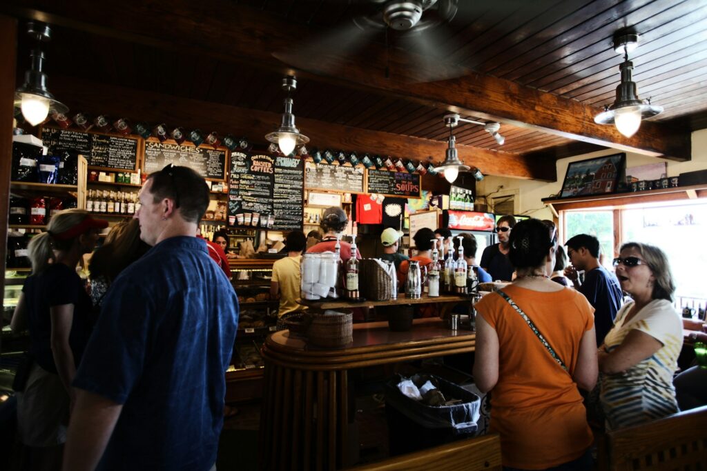 people standing in front of coffee bar